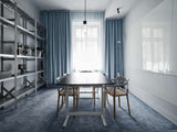 Minimal conference room with AVOLT conference table, wooden meeting chairs, metal shelving, blue curtains and carpet